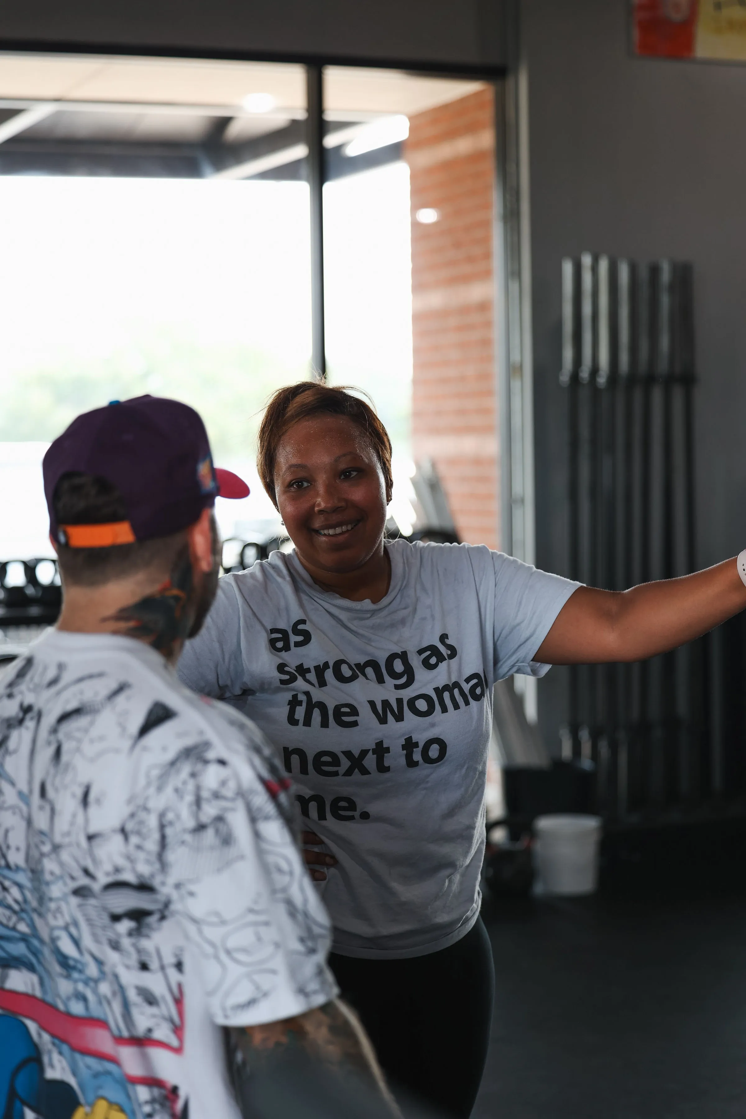 Coach working one-on-one with a smiling member